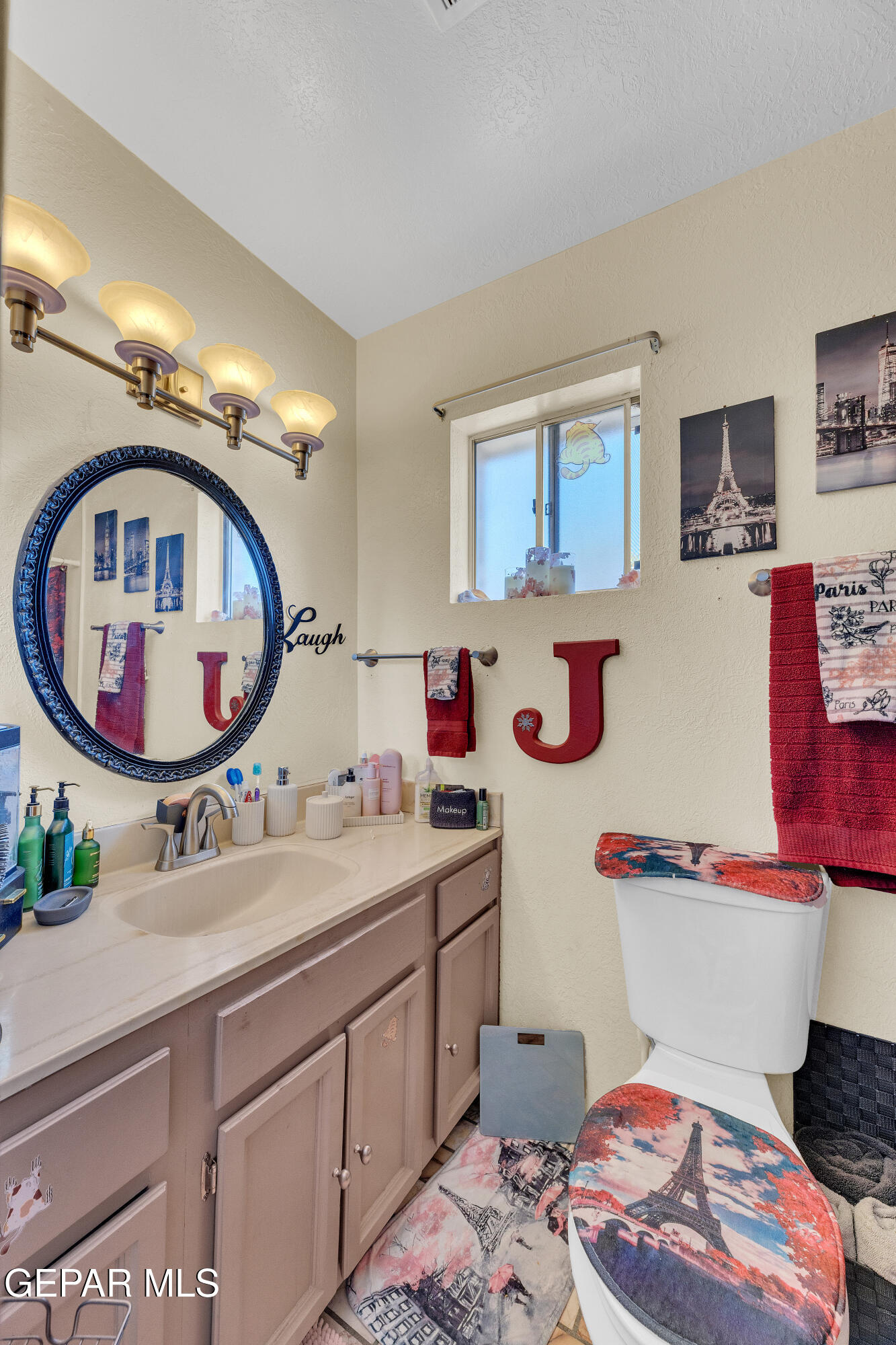 1664 Dick Ritter Street El Paso, TX 79936 - Photo 56 of 65 a bathroom with a sink mirror and toilet