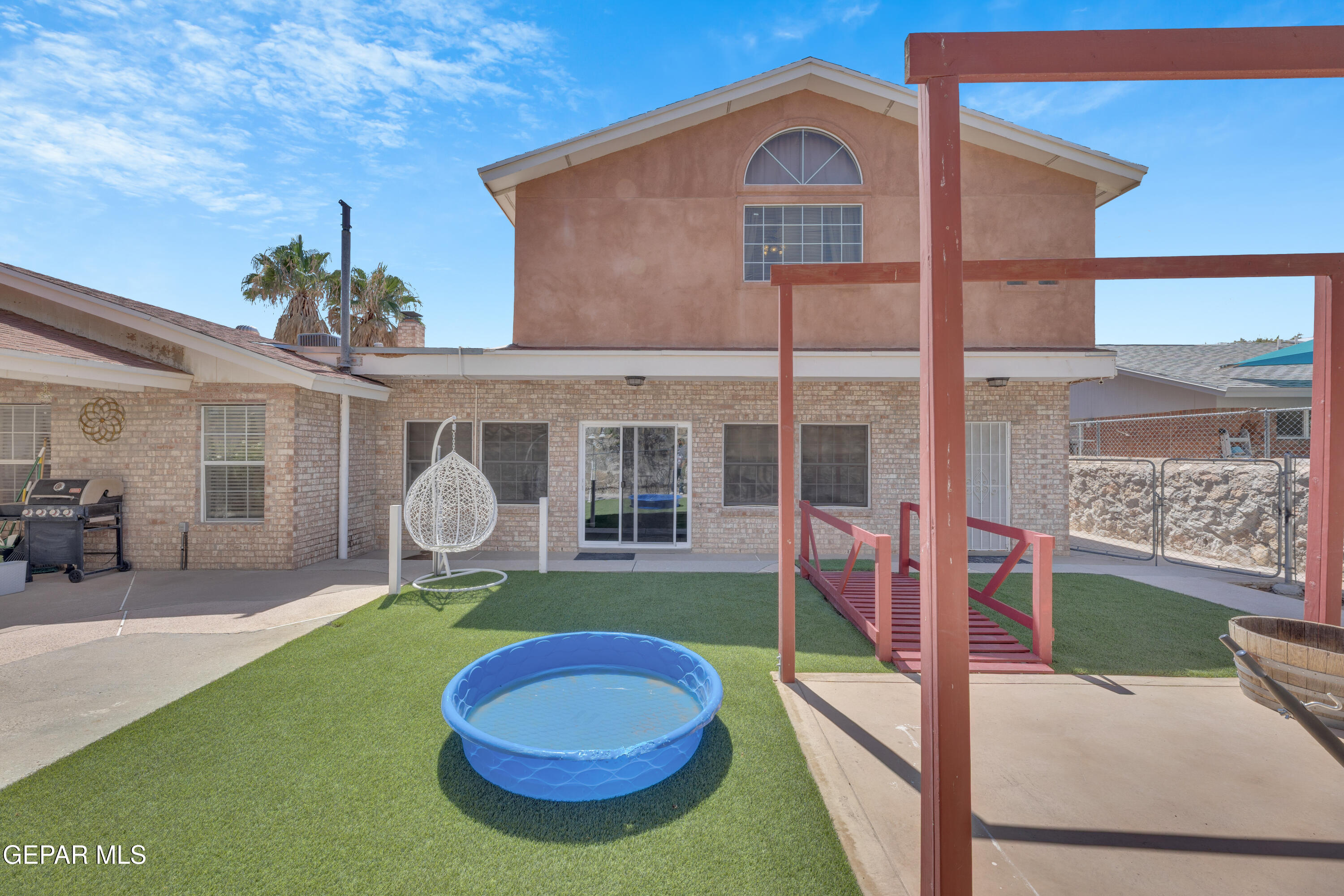 1664 Dick Ritter Street El Paso, TX 79936 - Photo 60 of 65 a view of a house with a backyard porch and sitting area