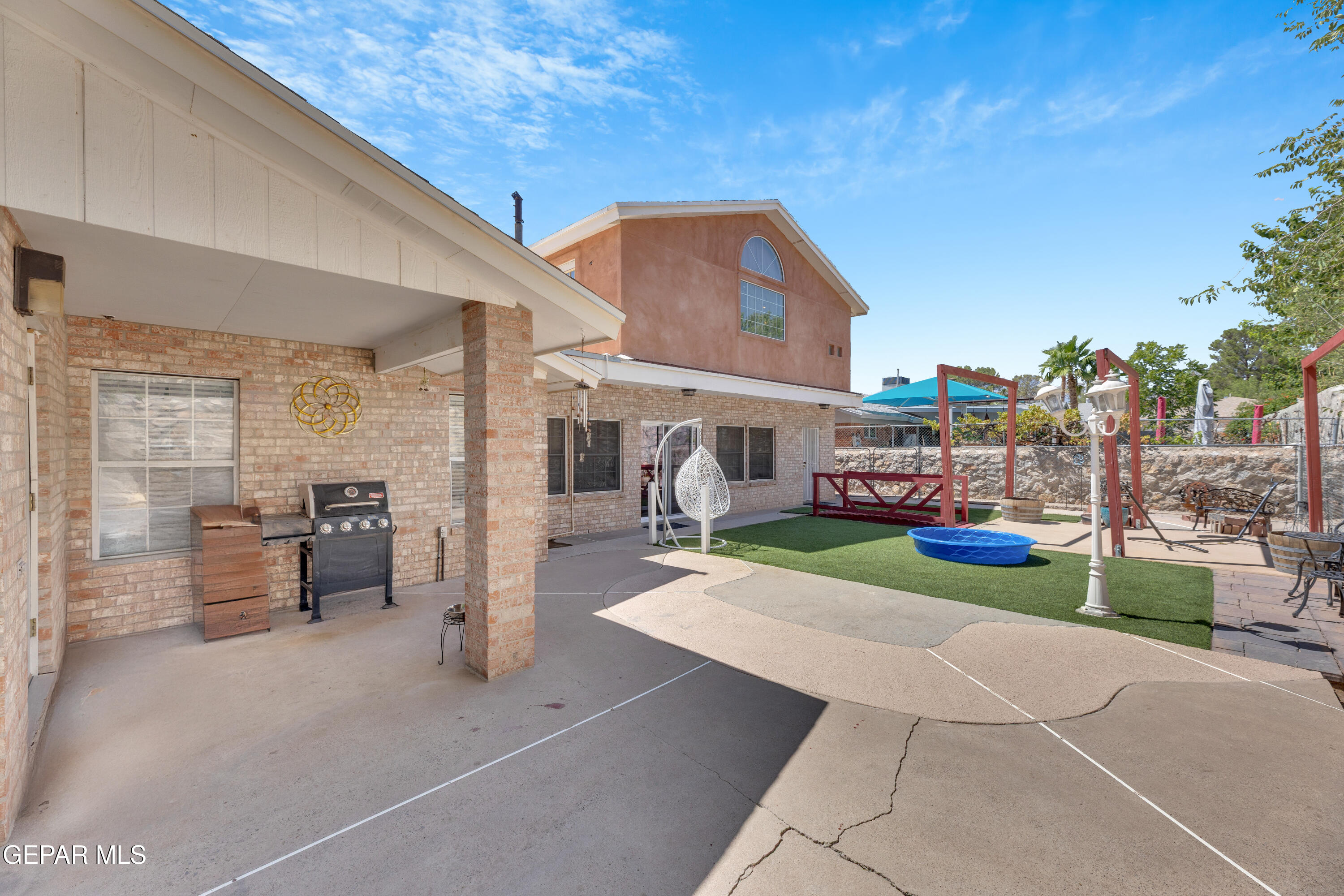 1664 Dick Ritter Street El Paso, TX 79936 - Photo 61 of 65 a view of a porch with furniture and a fire pit