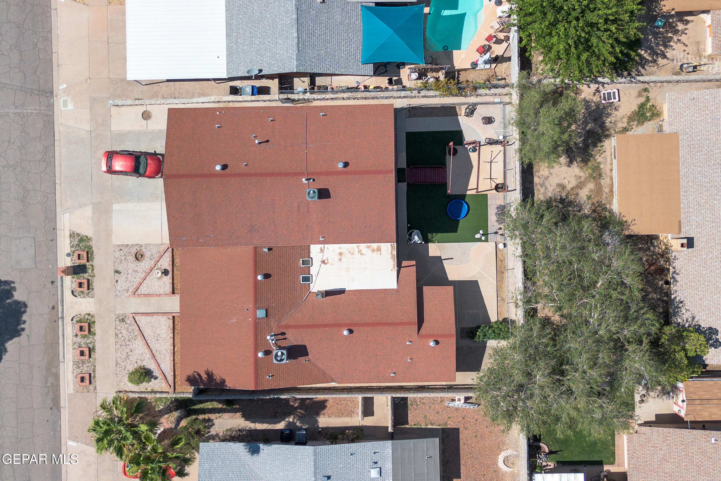 1664 Dick Ritter Street El Paso, TX 79936 - Photo 7 of 65 an aerial view of a house with a yard and a large tree