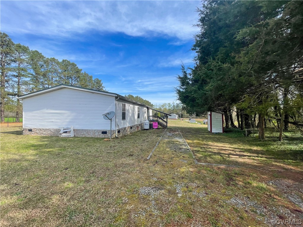 2950 Old Poole Road Alberta, VA 23821 - Photo 18 of 19 a view of a house with a yard