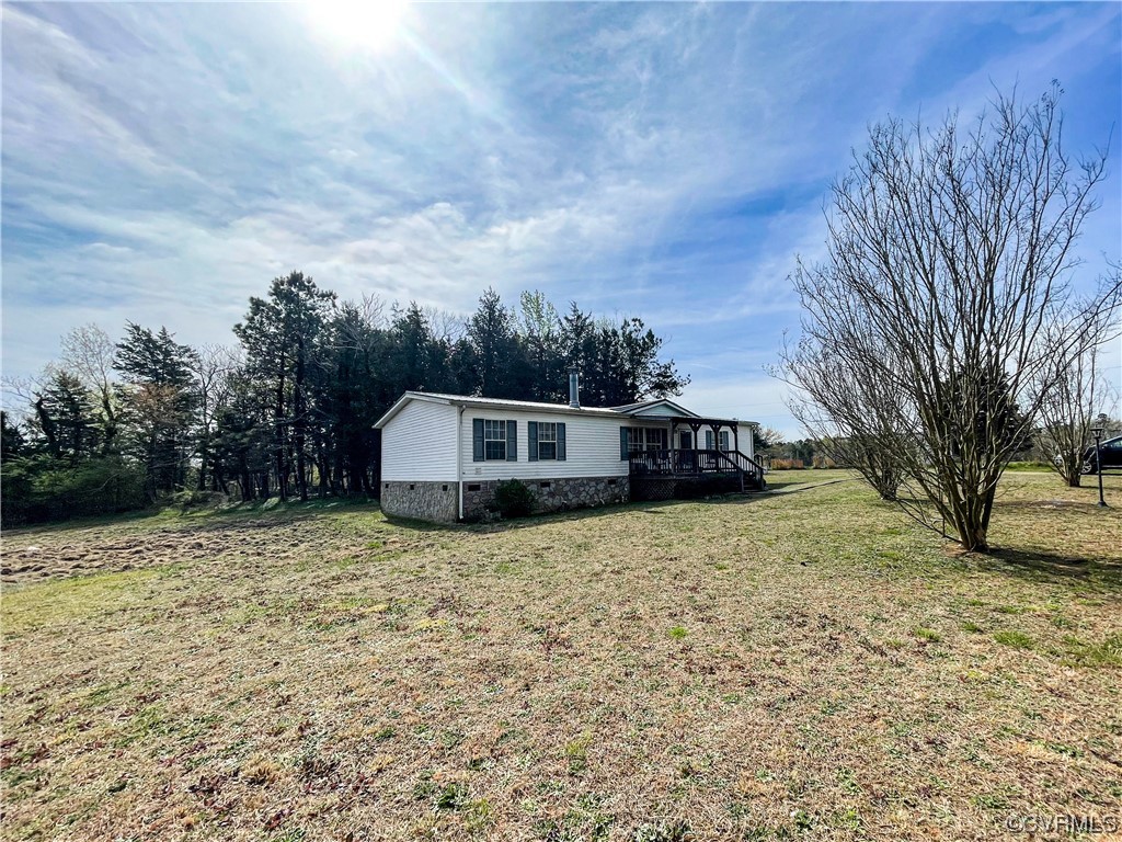 2950 Old Poole Road Alberta, VA 23821 - Photo 2 of 19 a house with trees in the background