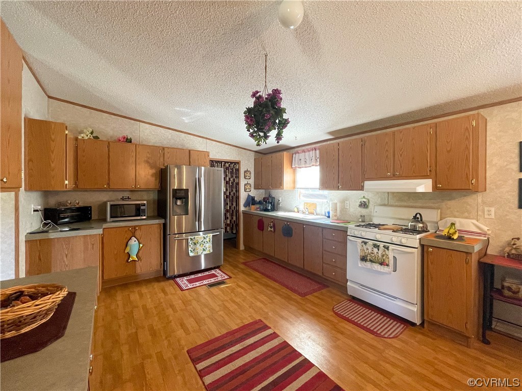 2950 Old Poole Road Alberta, VA 23821 - Photo 6 of 19 a kitchen with granite countertop stainless steel appliances cabinets a sink and a center island