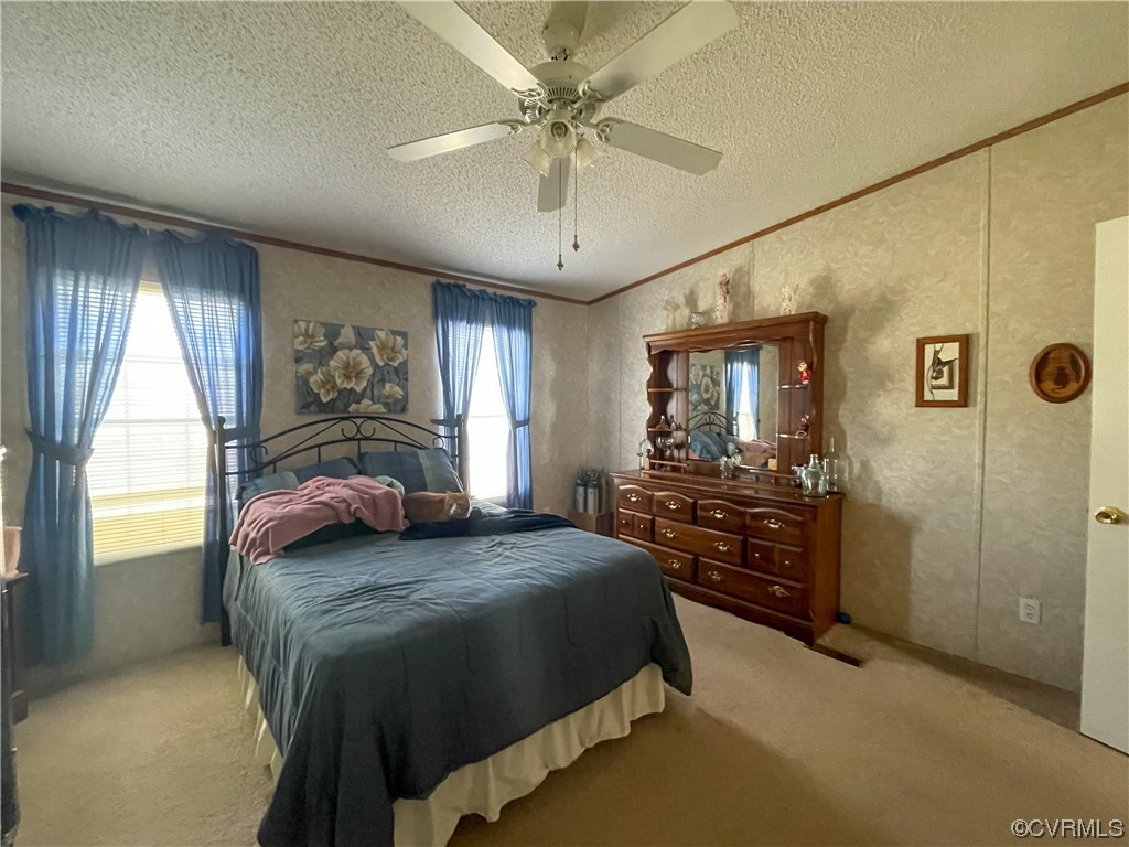 2950 Old Poole Road Alberta, VA 23821 - Photo 7 of 19 a bedroom with a bed and a chandelier