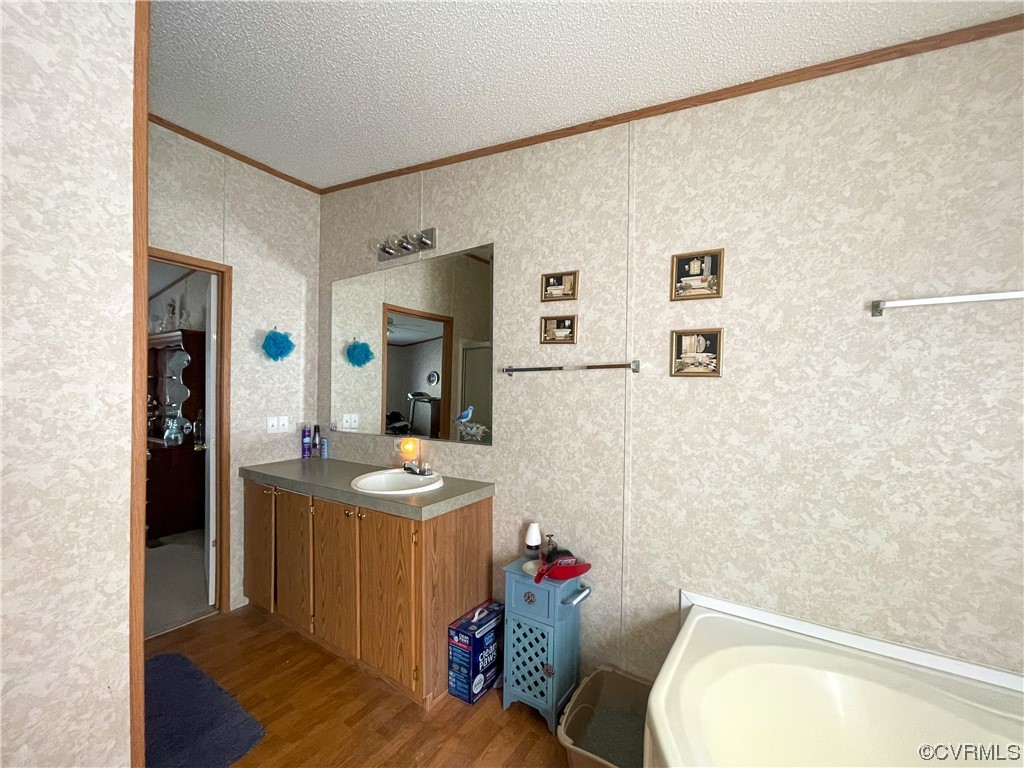 2950 Old Poole Road Alberta, VA 23821 - Photo 10 of 19 a bathroom with a granite countertop sink mirror vanity and toilet