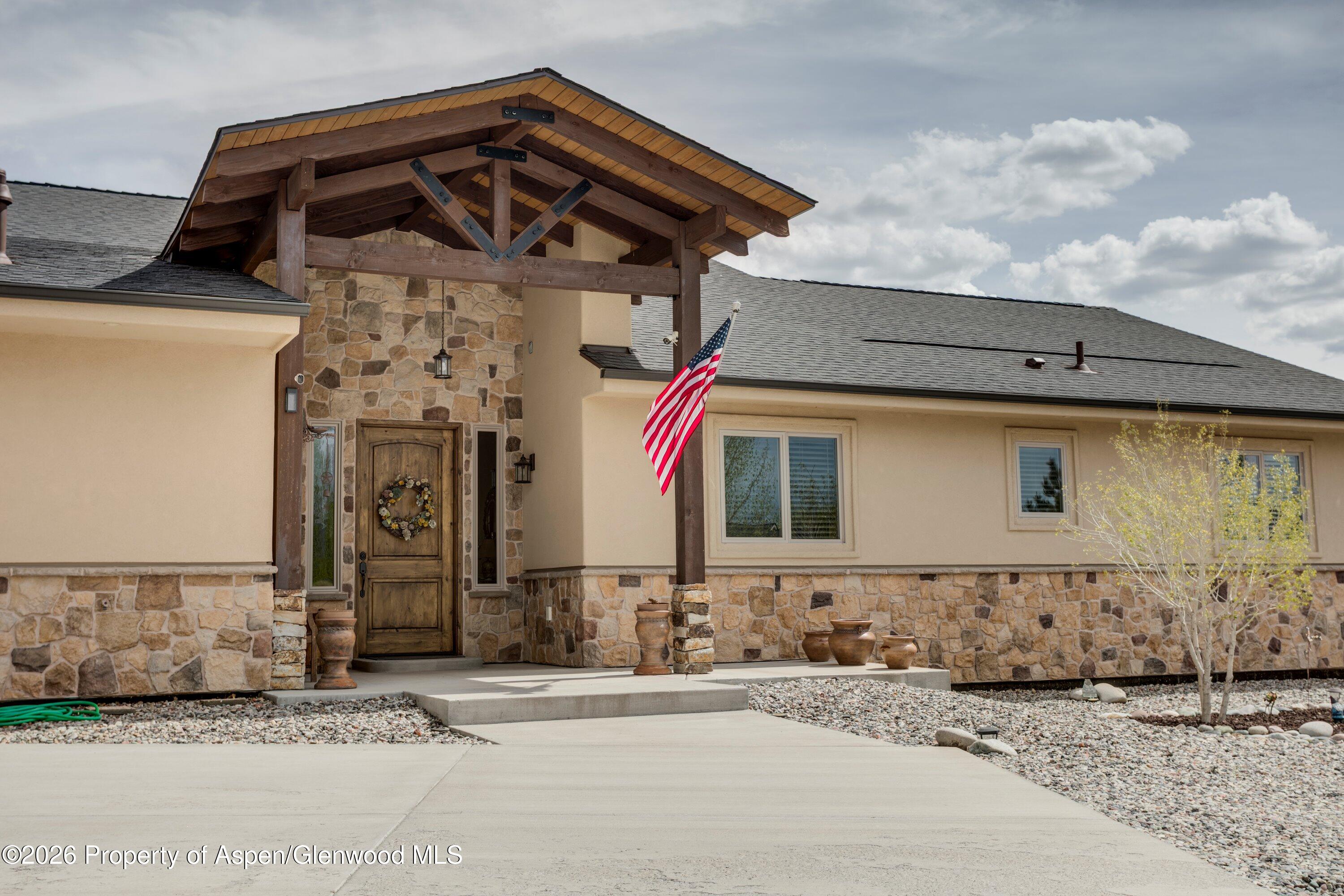 265 South Meadow Drive Rifle, CO 81650 - Photo 4 of 76 a front view of a house with a yard