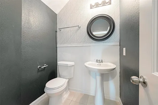 a bedroom with bed and a window