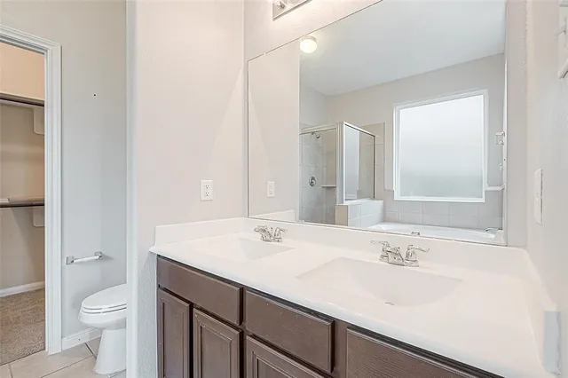 a bathroom with a tub and shower