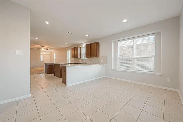 a view of kitchen with white cabinets
