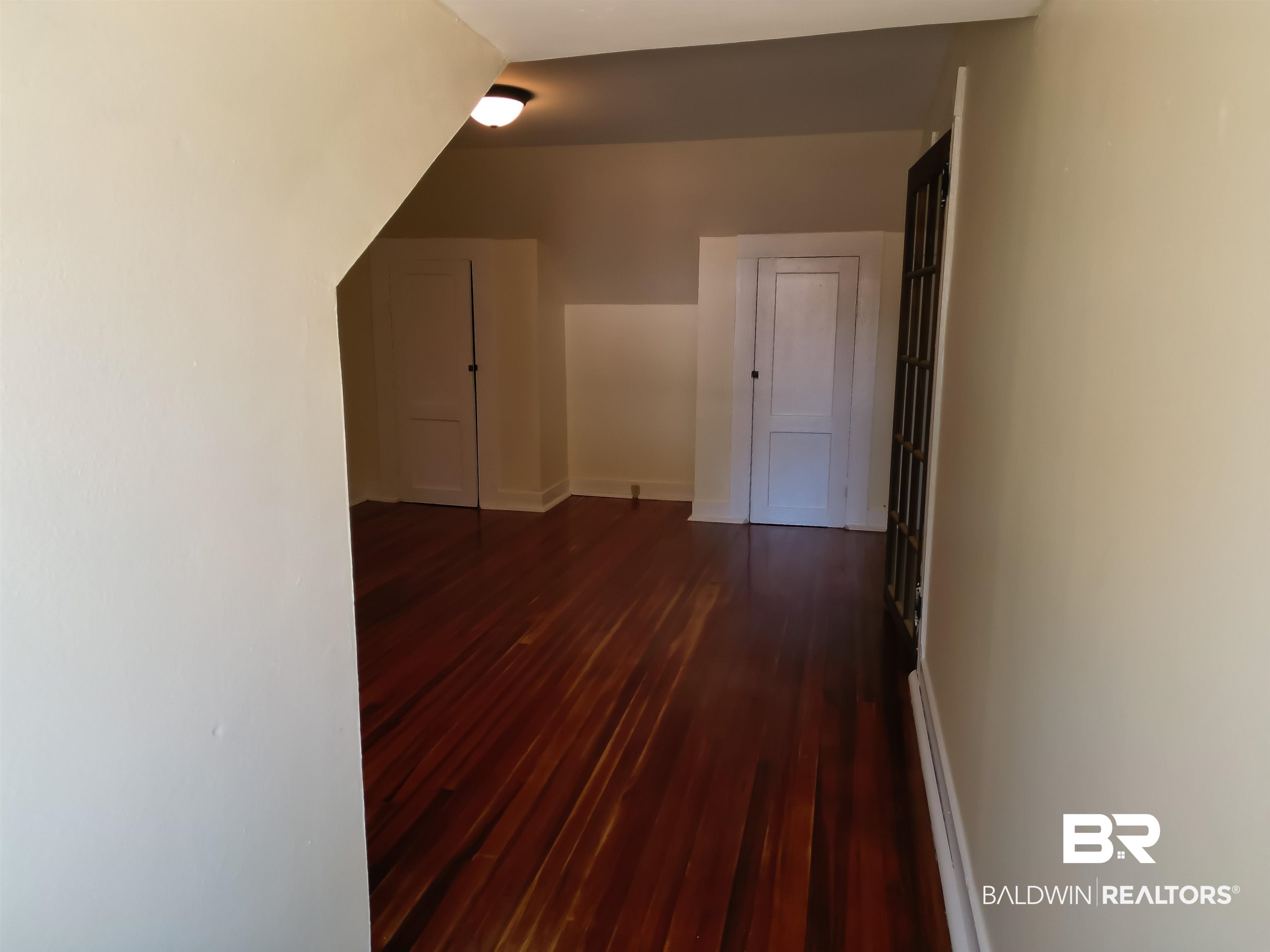73 Liberty Street Monroeville, AL 36460 - Photo 24 of 29 Additional living space featuring dark hardwood / wood-style flooring
