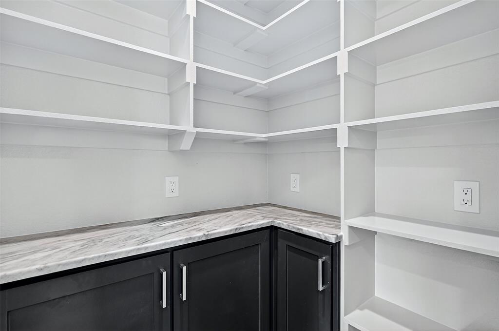 4805 Dry Creek Road Sherman, TX 75092 - Photo 15 of 29 a kitchen with a sink and cabinets
