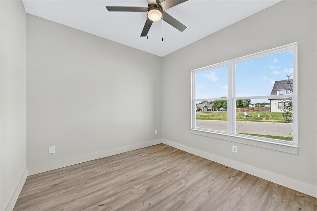 4805 Dry Creek Road Sherman, TX 75092 - Photo 23 of 29 wooden floor in an empty room with a window