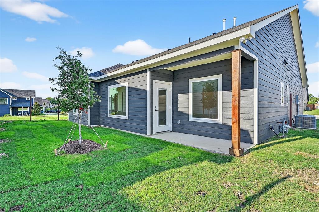 4805 Dry Creek Road Sherman, TX 75092 - Photo 28 of 29 a view of a house with a yard and tree