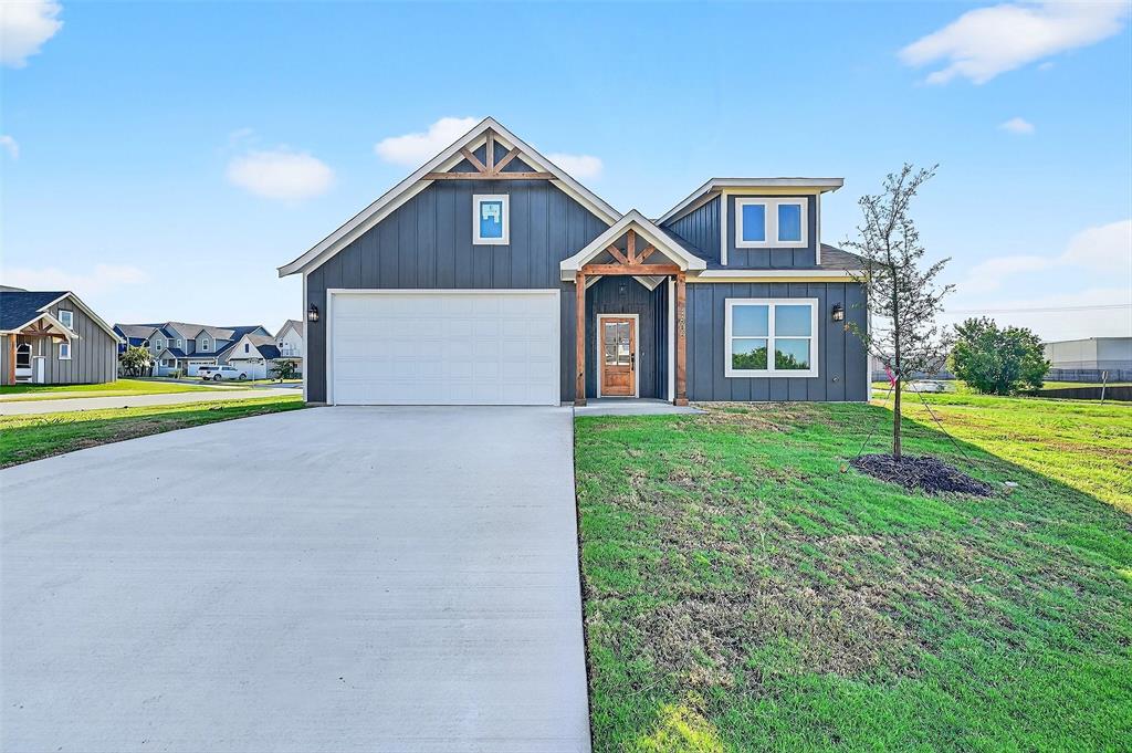 4805 Dry Creek Road Sherman, TX 75092 - Photo 3 of 29 a front view of house with yard and green space