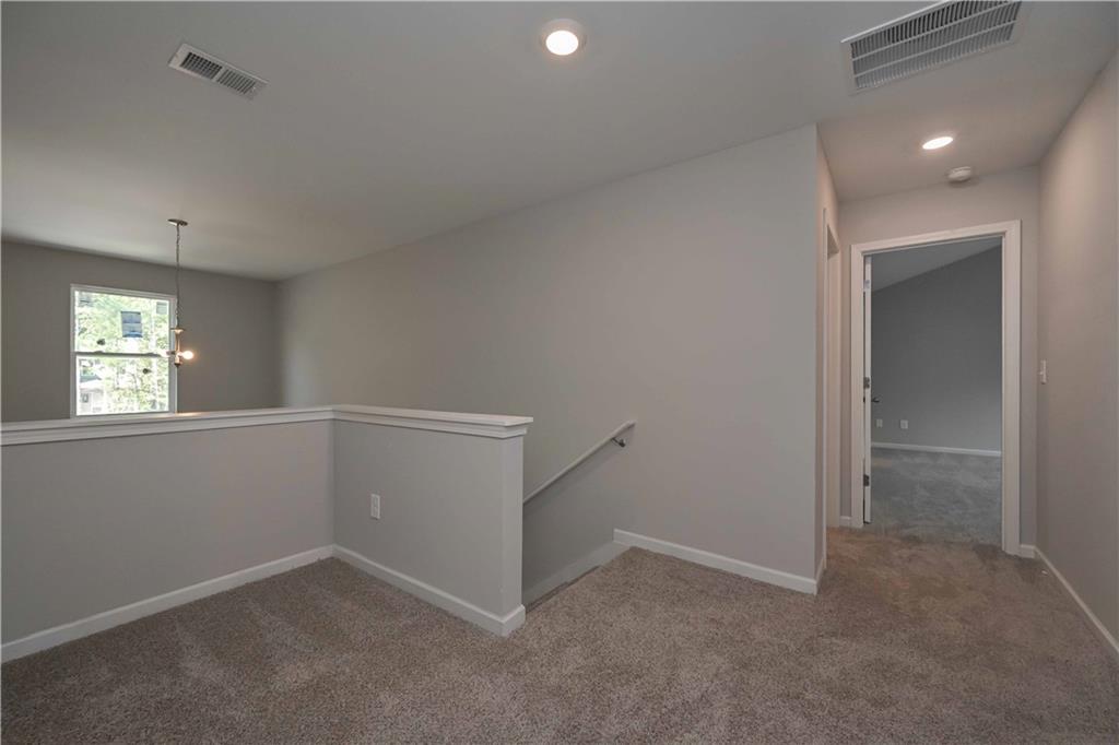 448 The Boulevard Newnan, GA 30263 - Photo 23 of 39 an empty room with windows and closet