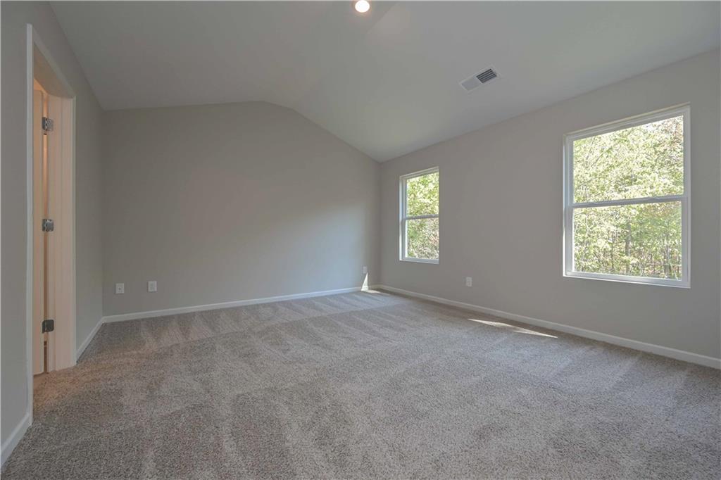 448 The Boulevard Newnan, GA 30263 - Photo 29 of 39 an empty room with windows