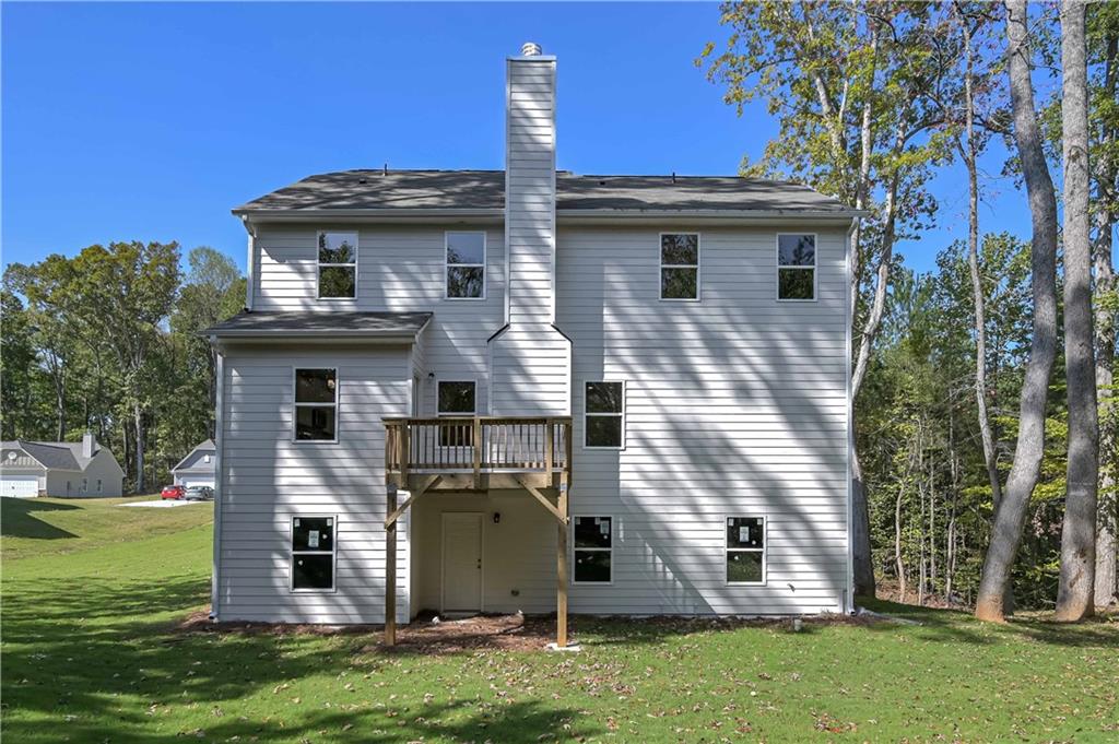 448 The Boulevard Newnan, GA 30263 - Photo 5 of 39 a front view of a house with garden