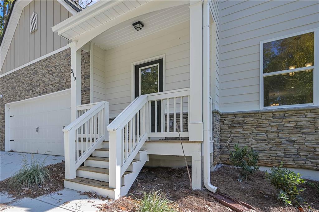 448 The Boulevard Newnan, GA 30263 - Photo 7 of 39 a view of a house with wooden fence