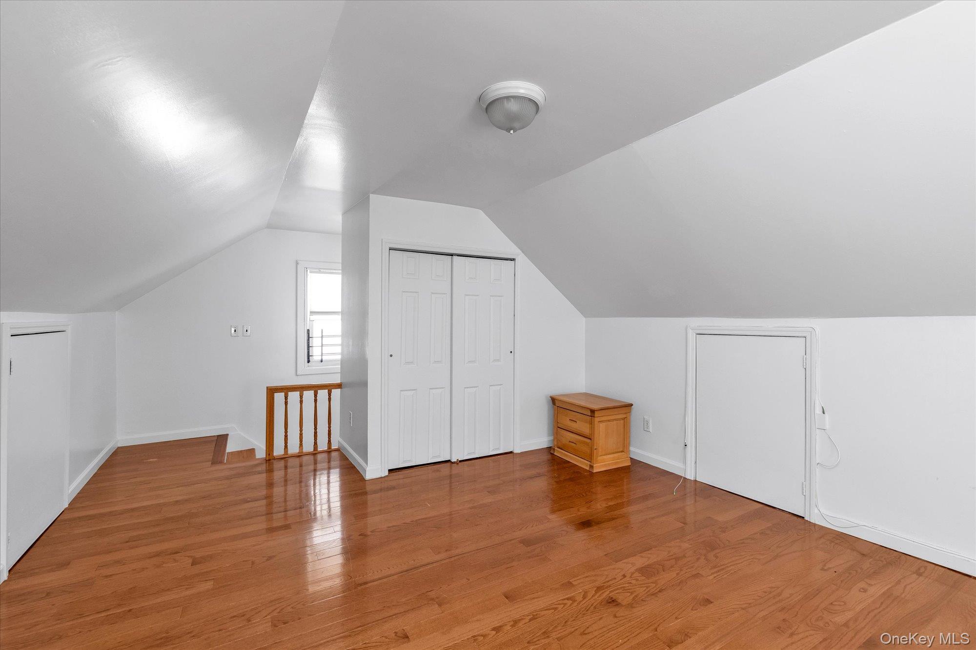 48-18 202nd Street Queens, NY 11364 - Photo 17 of 23 a view of empty room with wooden floor