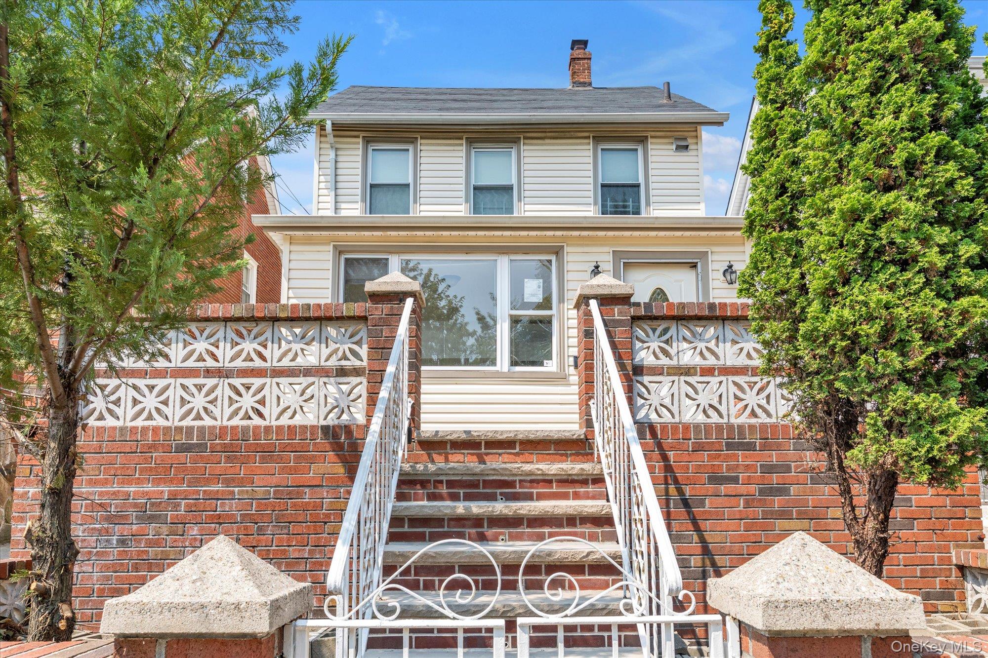 48-18 202nd Street Queens, NY 11364 - Photo 2 of 23 a front view of a building