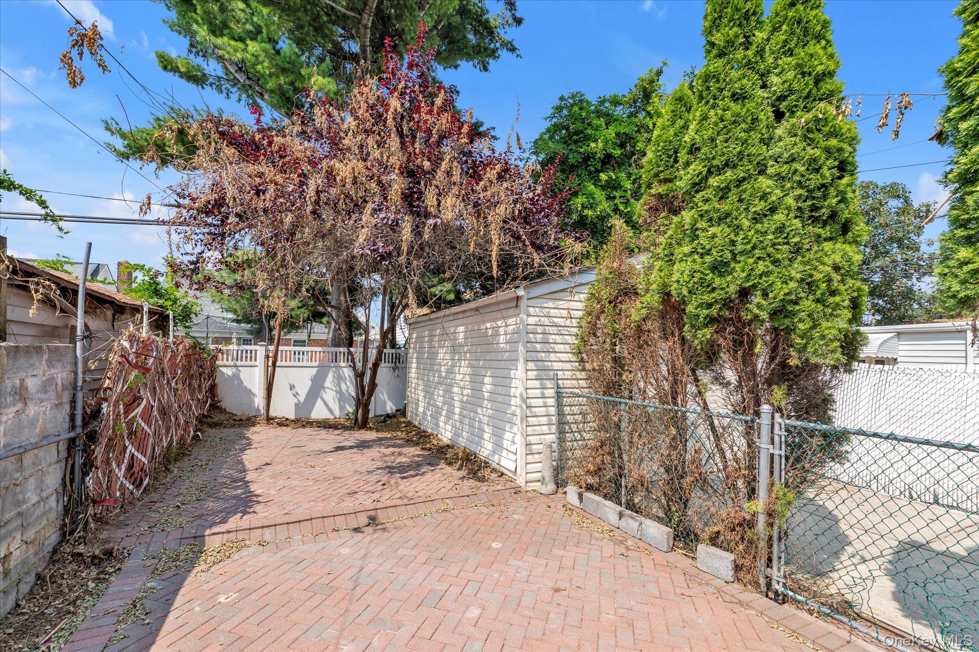 48-18 202nd Street Queens, NY 11364 - Photo 22 of 23 a view of a backyard of the house