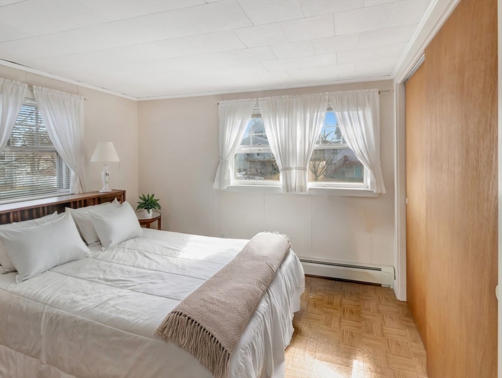 10 Allison Road Saugus, MA 01906 - Photo 27 of 42 a bedroom with a bed and a window