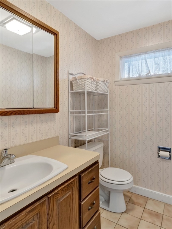 10 Allison Road Saugus, MA 01906 - Photo 28 of 42 a bathroom with a sink a toilet and shower