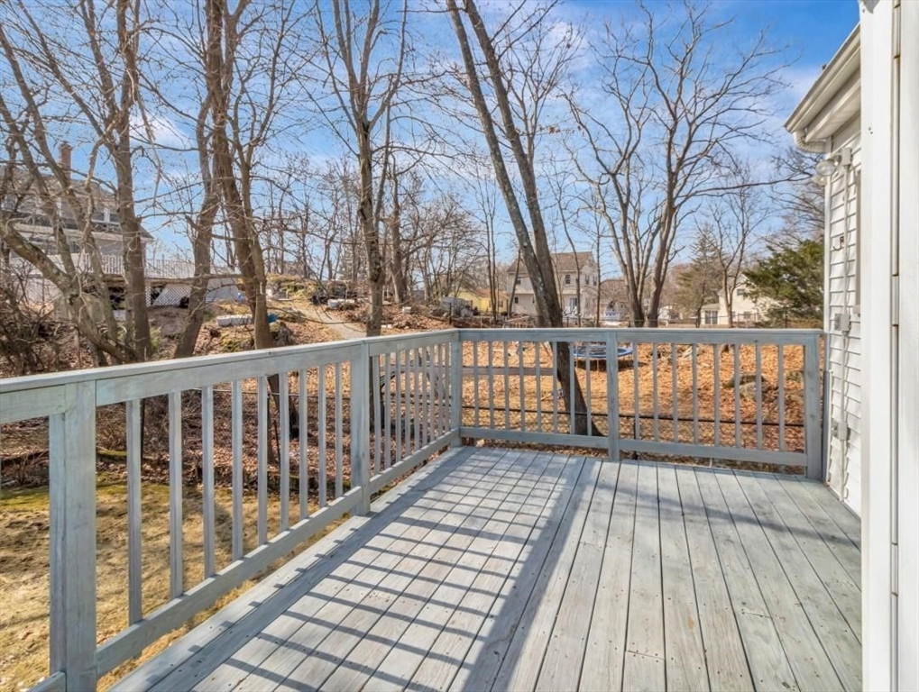 10 Allison Road Saugus, MA 01906 - Photo 32 of 42 a view of a wooden balcony with wooden floor and fence