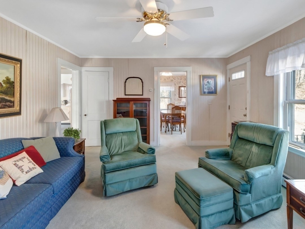 10 Allison Road Saugus, MA 01906 - Photo 5 of 42 a living room with furniture and a chandelier