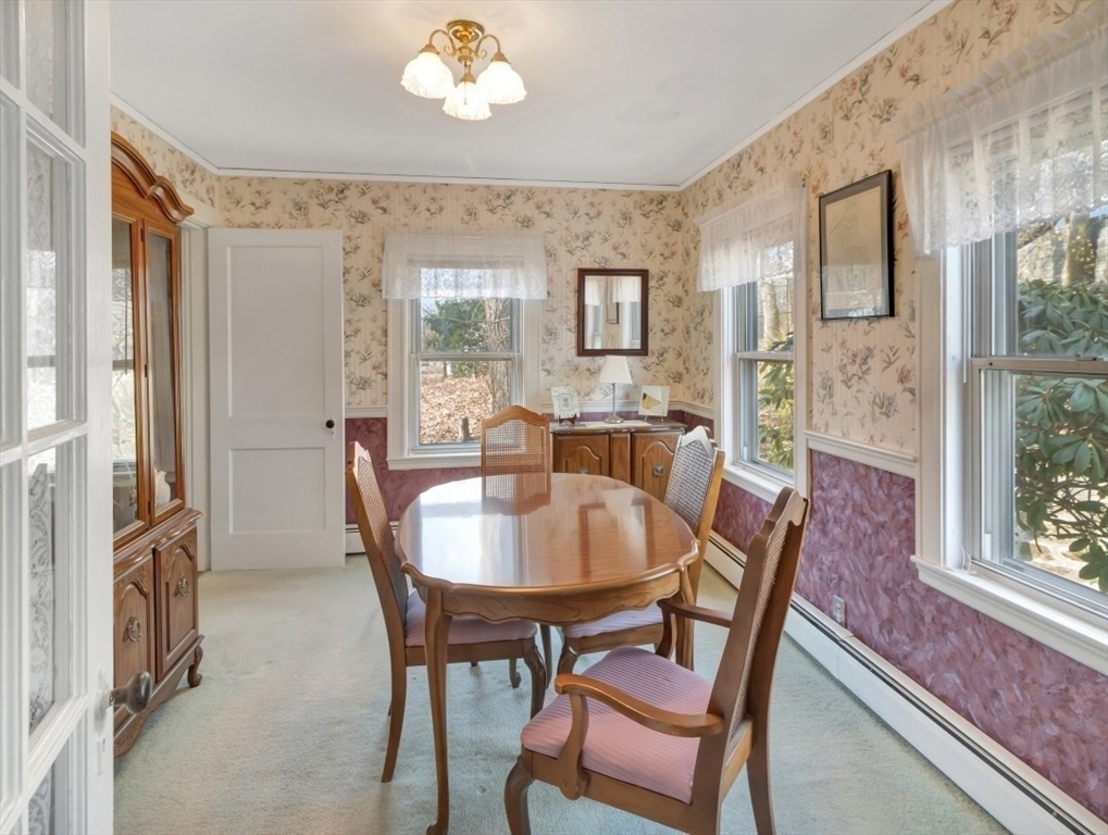10 Allison Road Saugus, MA 01906 - Photo 8 of 42 a view of a dining room with furniture wooden floor and a chandelier