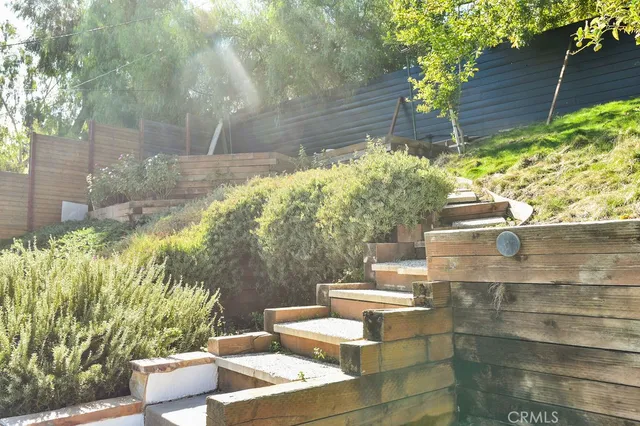 a view of a chairs and table in backyard