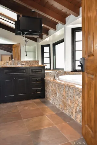 a bathroom with a bathtub and a sink