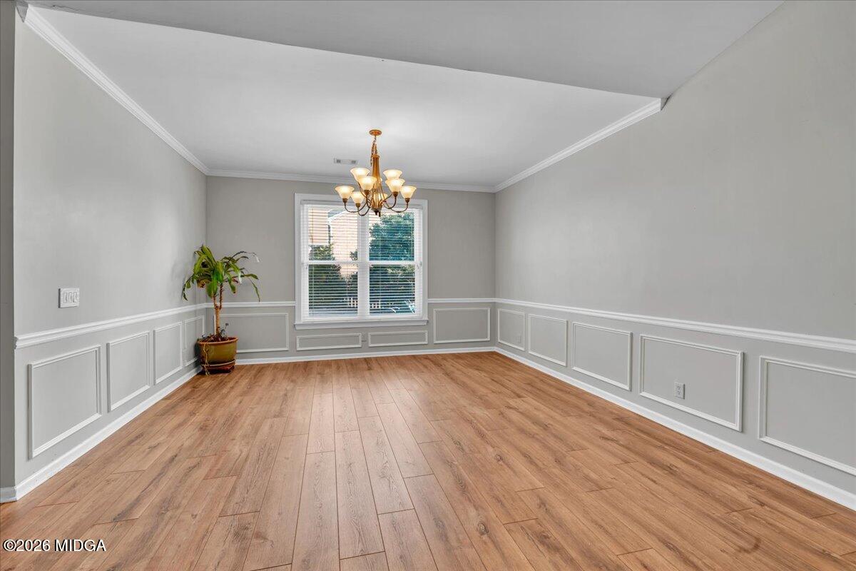 102 Fairways Court Macon, GA 31220 - Photo 13 of 47 a view of an empty room with wooden floor and a window