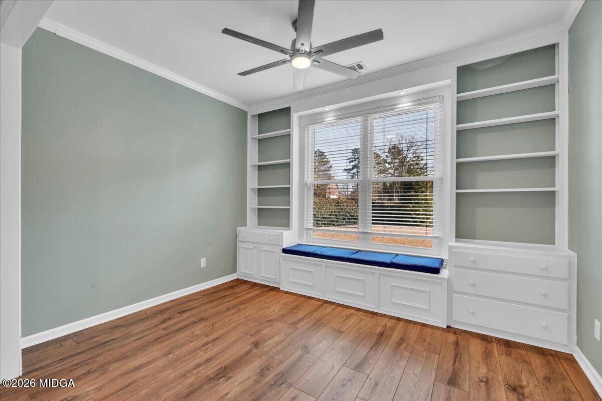 102 Fairways Court Macon, GA 31220 - Photo 20 of 47 a view of an empty room with a window and wooden floor