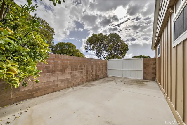 a vase with flowers sitting on a table in front of a door