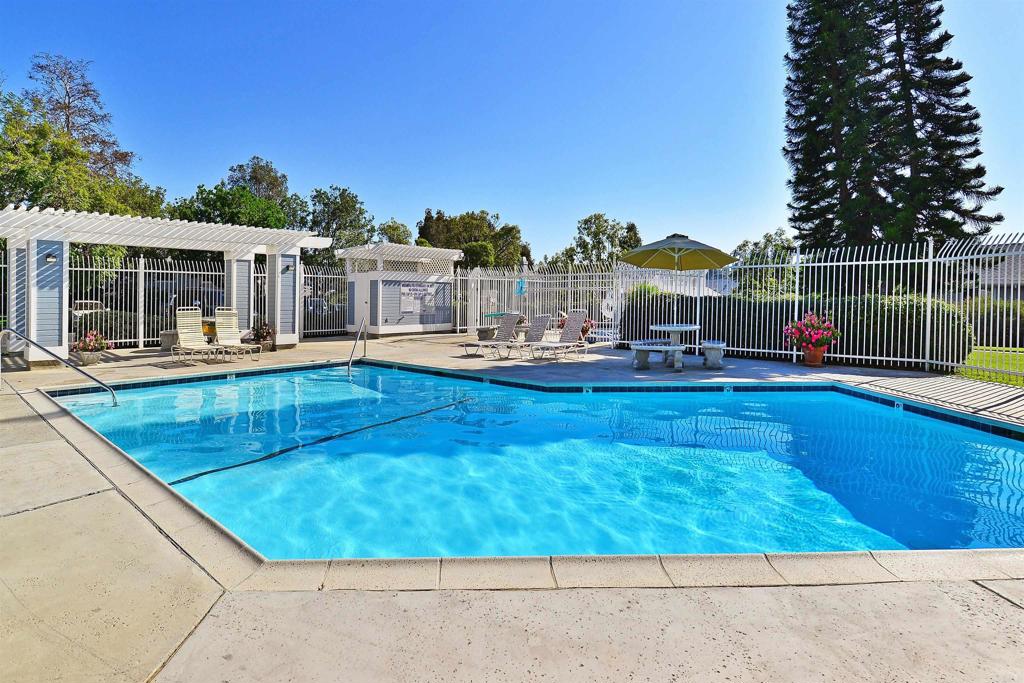421 Windjammer Circle Chula Vista, CA 91910 - Photo 6 of 17 a swimming pool view with a seating space and a garden view