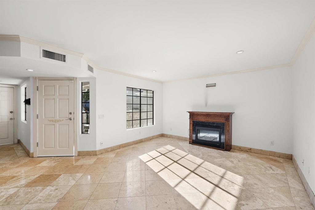 421 Windjammer Circle Chula Vista, CA 91910 - Photo 9 of 17 a view of empty room with a fireplace and window