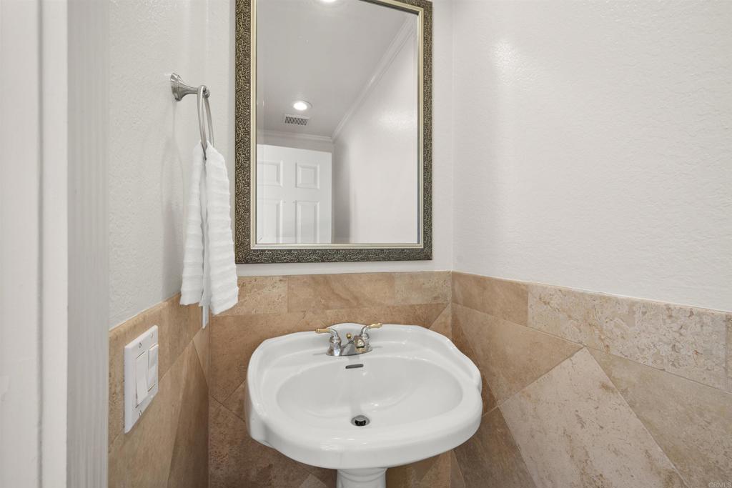 421 Windjammer Circle Chula Vista, CA 91910 - Photo 10 of 17 a bathroom with a sink and a mirror
