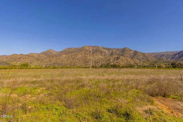 a view of an ocean and a mountain