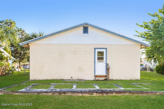 a front view of house with garden
