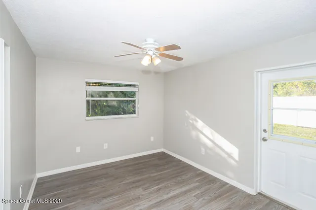 a view of an empty room with a window