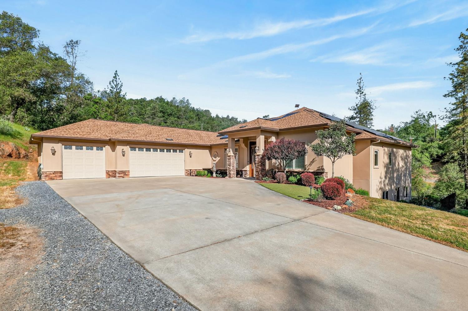 4554 Cross Creek Road Cool, CA 95614 - Photo 3 of 92 a front view of a house with a yard and garage