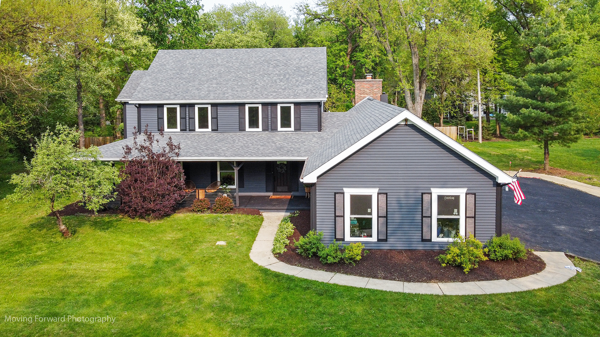 461 Huntley Road Crystal Lake, IL 60014 - Photo 1 of 45 a front view of a house with a garden