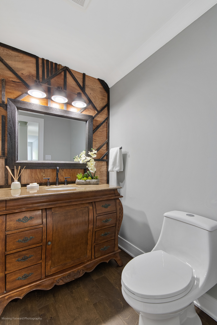 461 Huntley Road Crystal Lake, IL 60014 - Photo 12 of 45 a bathroom with a toilet sink and mirror