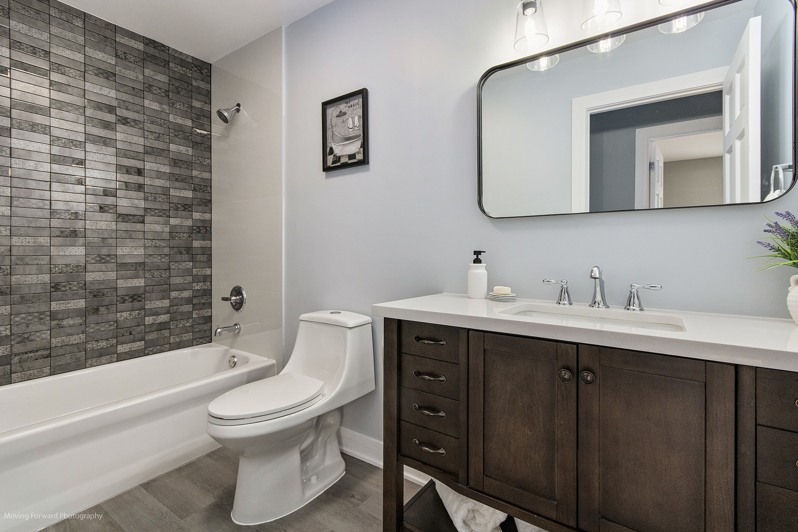 461 Huntley Road Crystal Lake, IL 60014 - Photo 27 of 45 a bathroom with a toilet a sink a mirror and bathtub