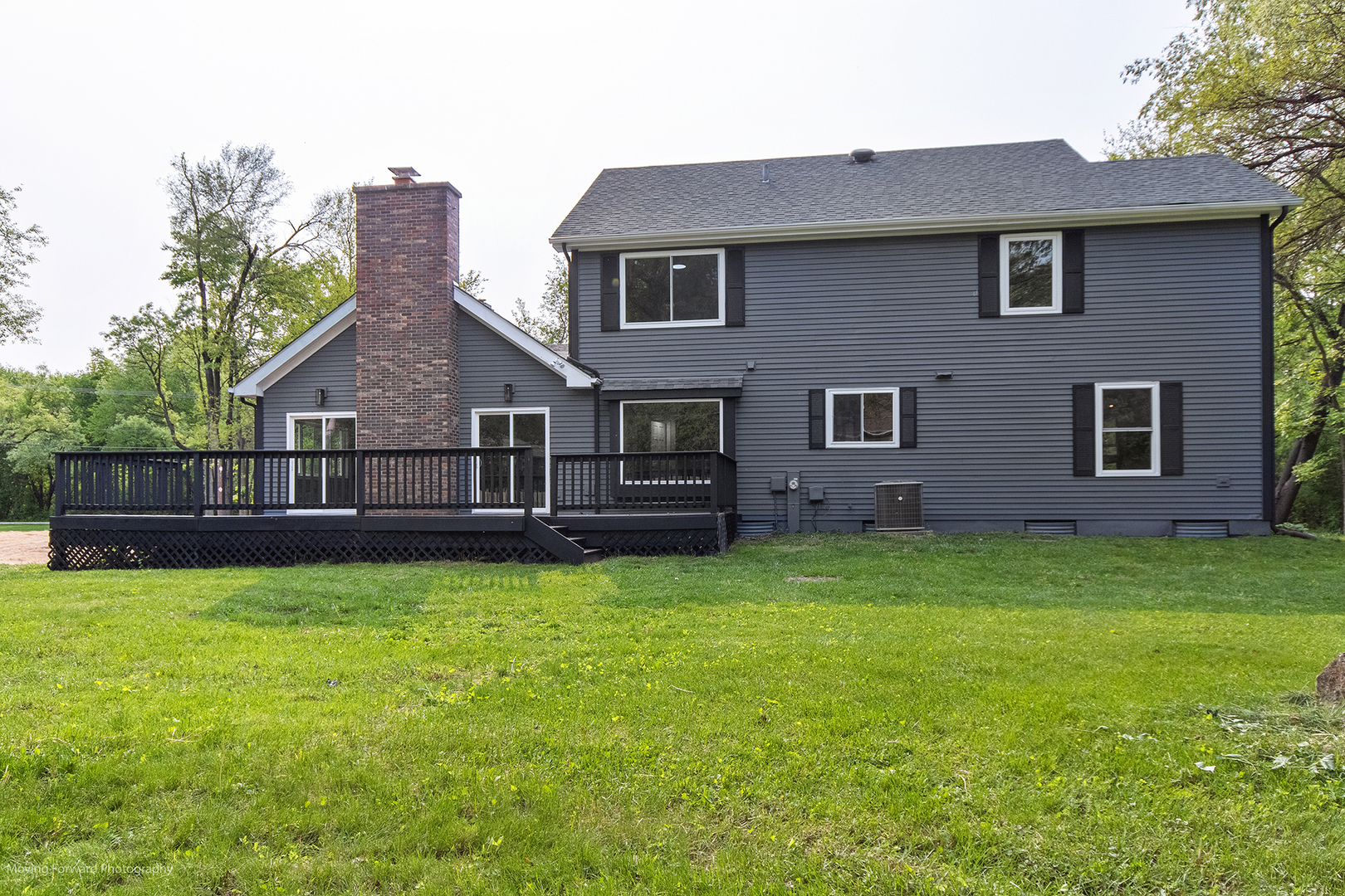 461 Huntley Road Crystal Lake, IL 60014 - Photo 40 of 45 a view of a house with a yard and a porch