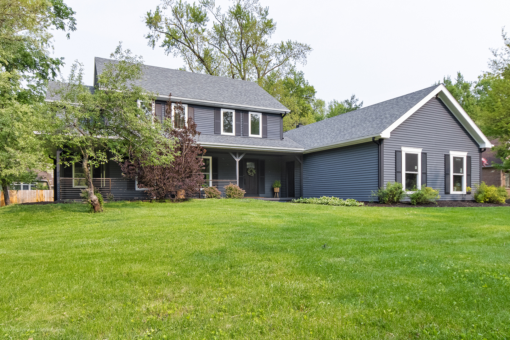 461 Huntley Road Crystal Lake, IL 60014 - Photo 42 of 45 a front view of a house with a garden