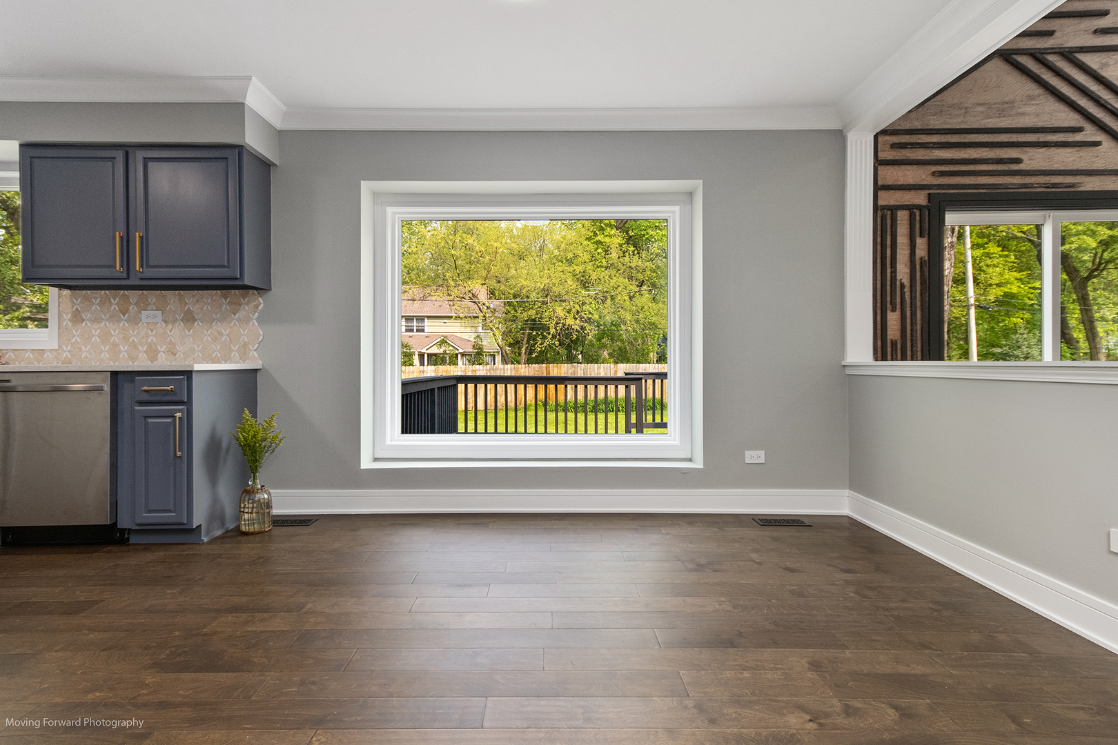 461 Huntley Road Crystal Lake, IL 60014 - Photo 8 of 45 a view of an empty room with a window and wooden floor