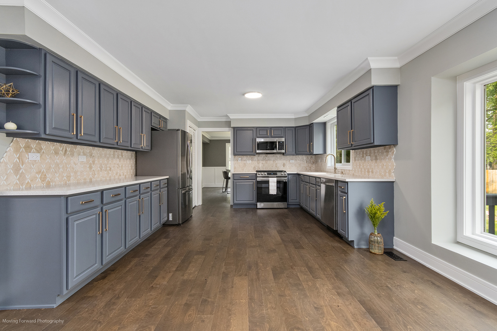 461 Huntley Road Crystal Lake, IL 60014 - Photo 9 of 45 a kitchen with stainless steel appliances granite countertop a stove sink and cabinets