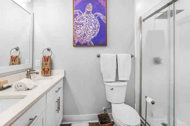 a bathroom with a sink toilet and vanity